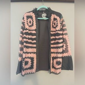 Brown with pink embroidery jacket. Made in Spain.